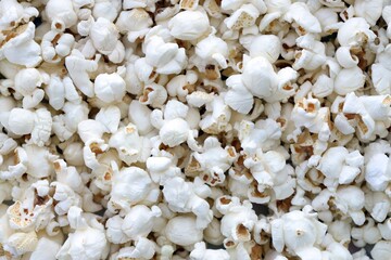Popcorn texture background. Big amount of popcorn as pattern photo