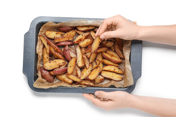 Young woman holding baking tray with tasty baked potato on white background, closeup