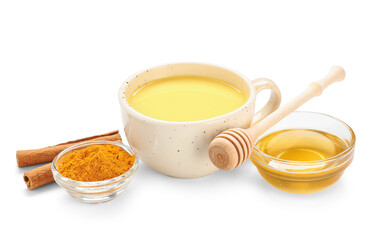 Cup of healthy turmeric drink and ingredients isolated on white background, closeup