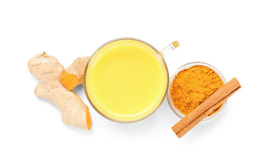 Cup of tasty turmeric drink and ingredients isolated on white background, closeup