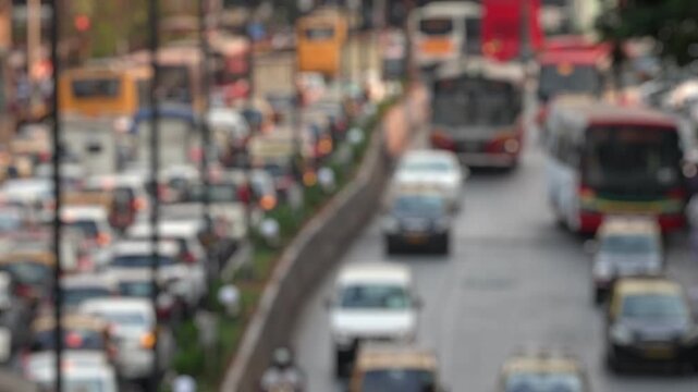 Bokeh view of road traffic near Chhatrapati Shivaji Maharaj Terminus (CSMT railway station) Mumbai, India. Blurred background footage.