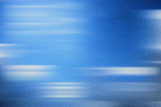 Bright blue gradient blur abstract representing fluidity, clarity, and calmness through smooth motion and minimalist modern design.