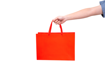 Hand holding empty red paper bag isolated on a transparent background.