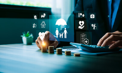 Financial planning and insurance protection concept with businessman stacking coins and using...