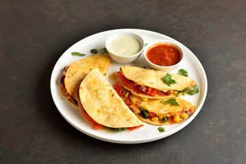 Quesadilla with fresh vegetables served with sauce