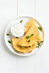 Chicken avocado quesadillas served with sauce
