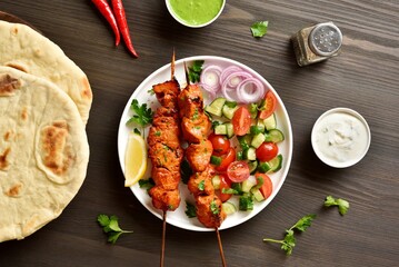 Tandoori skewers are marinated in spices, yogurt and lemon juice