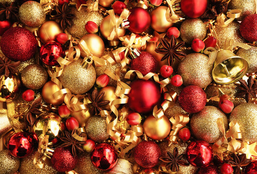 Golden and red balls, stars and berries background; festive Christmas and New Year celebration card, selective focus, shallow DOF