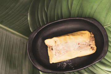 Tamal Typical Colombian Food Wrapped in Banana Leaves
