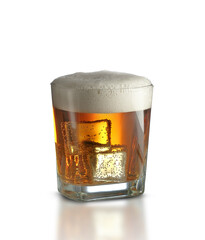 a glass of beer and ice cubes