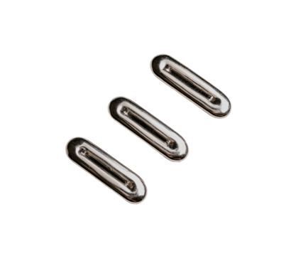 Three elongated, oval-shaped metal components, with a recessed channel down their center, arranged diagonally