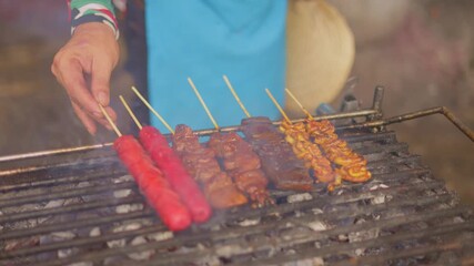 Daytime street vendor grilling marinated skewers and kebab, asian street cook basting skewers over charcoal during daytime, vibrant street food scene with marinated skewers cooking over fiery charcoal