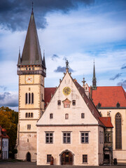 Fototapeta premium Historic town hall and St. Egidius Church in Bardejov, former free royal town in Slovakia, with medieval architecture and red roofs