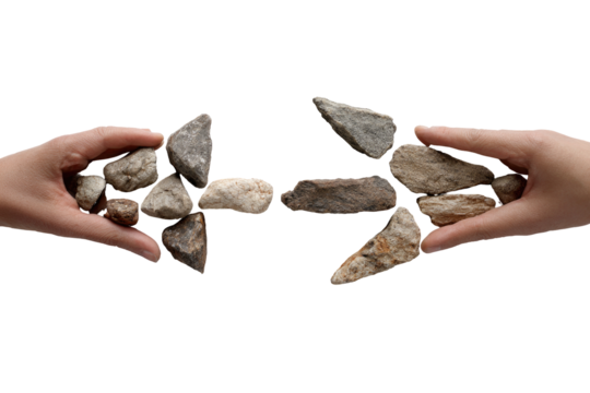 Two hands holding small stones arranged as arrows pointing towards each other
