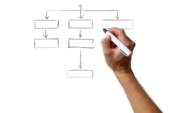 Hand drawing a hierarchical flowchart on a dark surface