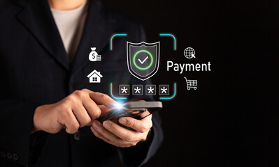 Businessman using smartphone for secure online payment with digital shield icon, representing cybersecurity, mobile banking, e-commerce transaction, data protection, and financial technology