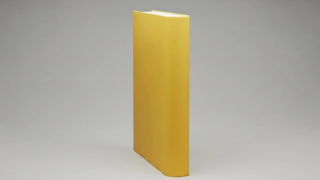A tall, thin, upright yellow hardcover book with a white top edge
