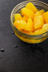 Pineapple canned chunks sweet fruit dessert tasty snack fresh delicious gourmet food background on the table rustic top view copy space keto and paleo diet vegetarian and vegan food