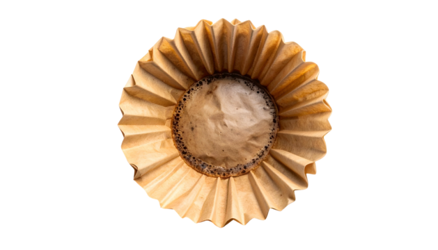 Overhead shot of a used, brown coffee filter with a dark, circular residue