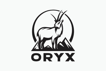 Majestic oryx stands proudly over the mountain peak in strong monochrome contrast