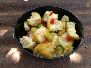 A bowl of ambarella fruit salad or Rujak Kedondong.