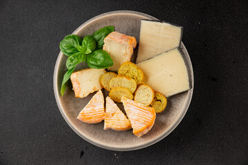 Cheese plate different kind of cheese appetizer tasty snack fresh delicious gourmet food background on the table rustic top view copy space