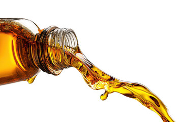 Amber liquid pouring from a bottle against a black background