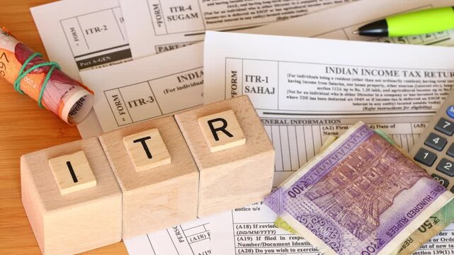  ITR forms. Tax return to show gross income subject to taxation for a given tax year. Financial concept. Rupees, calculator, Taxes India.
