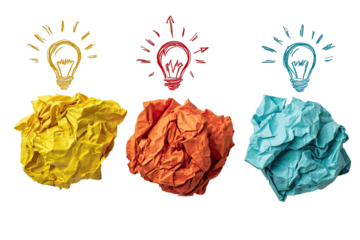 Four crumpled paper balls, each a different color (yellow, orange, red, teal), with a stylized lightbulb graphic above each