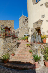 A narrow street among the old houses of Chianche. a village in the province of Avellino, Italy.