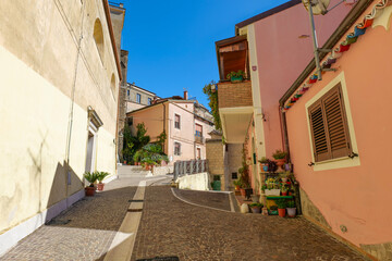 A narrow street among the old houses of Chianche. a village in the province of Avellino, Italy.