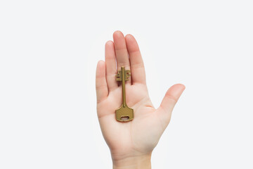 Hand holding a golden key, symbolizing access or opportunity