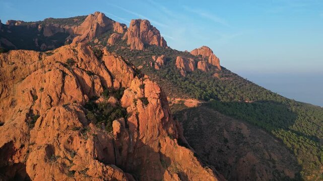 Panoramic aerial view of Esterel Mountains red cliffs overlooking the Mediterranean Sea on the French Riviera, Southern France, at sunset &ndash; dramatic mountain landscape and scenic coastline