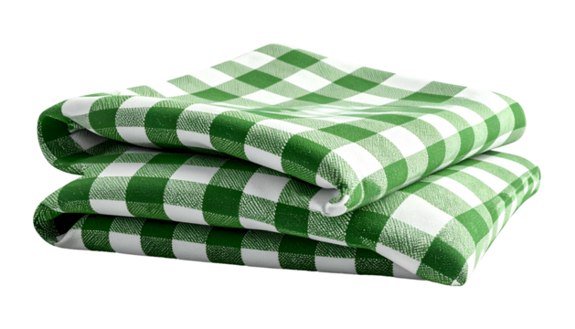 Stacked, green and white checkered tablecloths, folded neatly on a black backdrop
