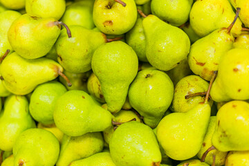 Green pears in a market