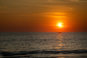 Beautiful sunset in the desert. Desert near the sea. Colorful sky. Warm summer evening.	
