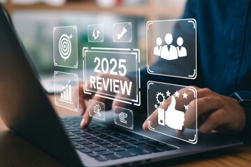 Person Reviewing 2025 with Laptop and Digital Icons