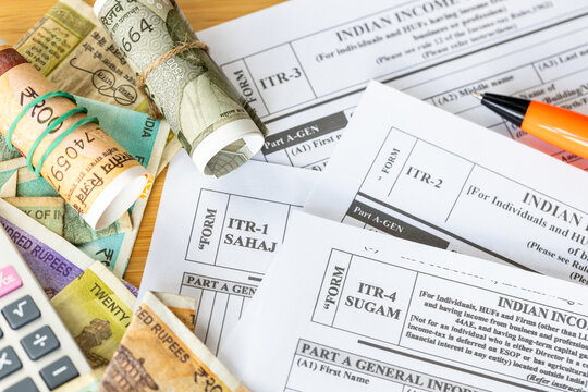  India taxes. Various ITR forms to fill out. Income tax return. Annual tax declaration. Financial concept. ITR written on wooden blocks. Close up