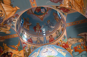 Colorful frescoes depicting religious scenes decorating the ceiling of a Agios Nikolaos Church in Paralimni, Cyprus