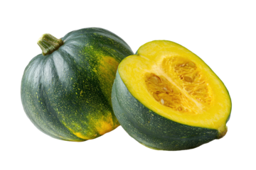 Two small, dark green and yellow patty pan squash, one whole and one halved, showing the inside