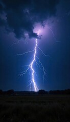 Dramatic Lightning Bolt Illuminates Stormy Night Sky, Powerful Nature Photography