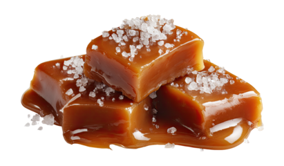 Stacked caramel squares, glistening with melted caramel, sprinkled with sea salt