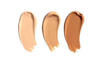 Three swatches of creamy makeup in varying skin tones against a black background