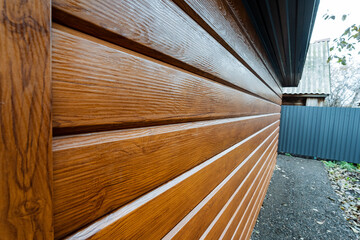 wood siding closeup, closeup of wooden siding details, detailed view of textured glossy wooden sidings, highresolution closeup emphasizing wood grain and reflective surface