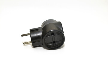 A black electric tee lies on a white background.