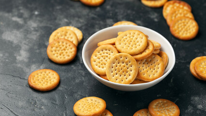 Cheese baked cheddar crackers in a white bowl