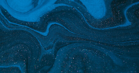 Marble background. Spilling fluid. Blur blue pink color ink chemical sparkling pigment floating on acrylic art creative abstraction.