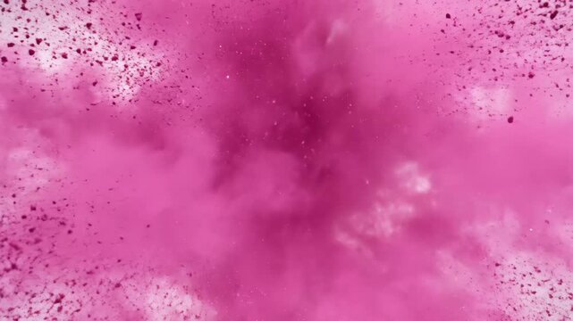 Pink Powder Explosion - A vibrant pink powder explosion bursts outwards against a light background. The video captures the dynamic movement and texture of the cloud of powder.