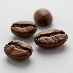 Obraz premium AI Generated: Four roasted coffee beans at different angles on neutral gray background