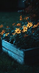 Yellow flowers bloom in a wooden planter box at twilight.